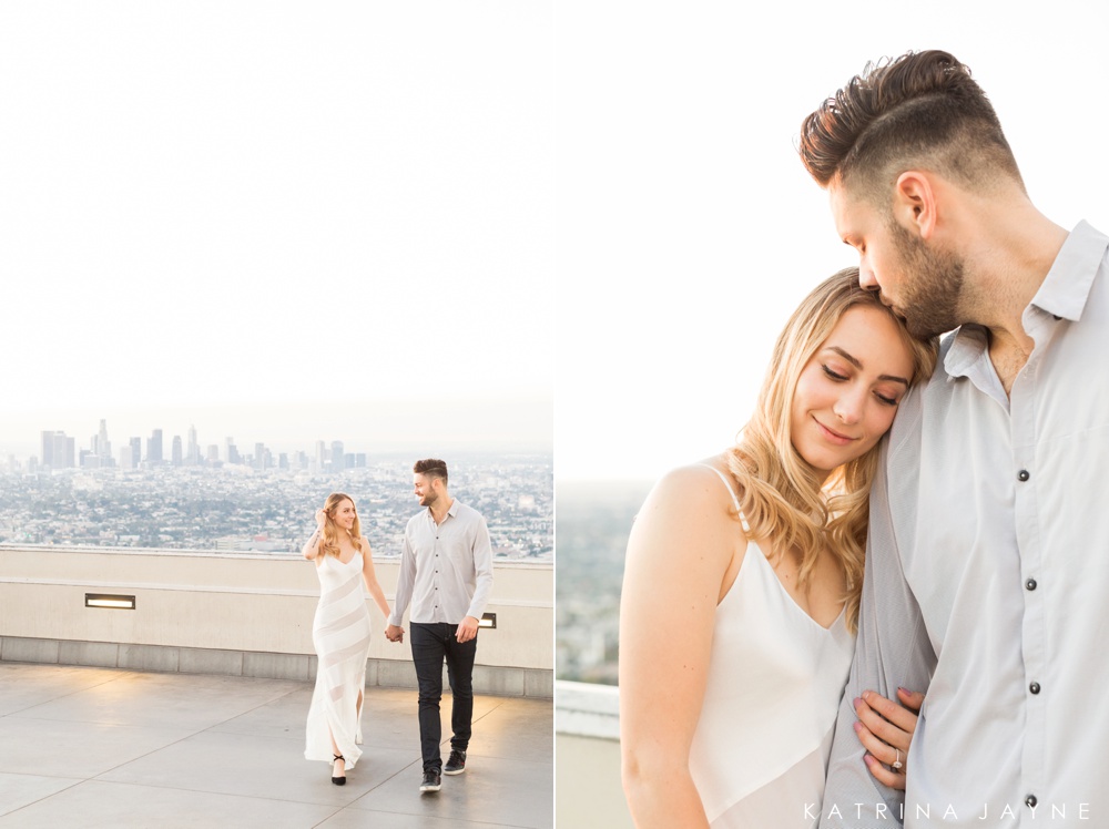 man and woman with downtown los angeles in the background